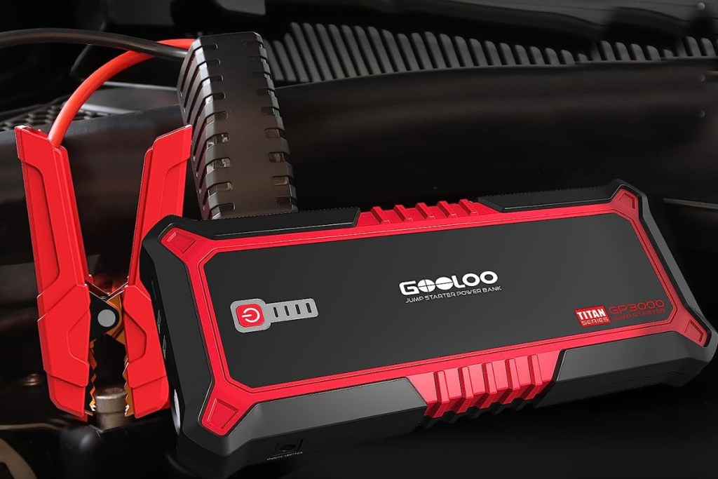 car jump starter with cables on battery
