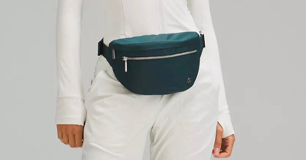 lululemon green belt bag on womans waist