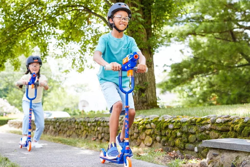 kids riding nerf blaster scooters