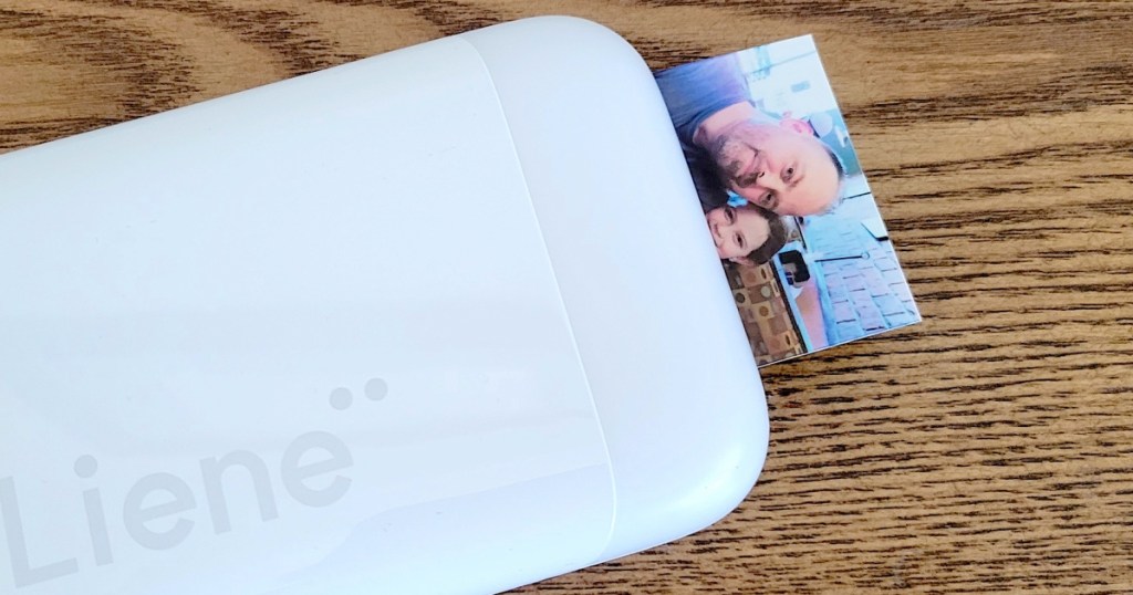 portable photo printer printing out photo 