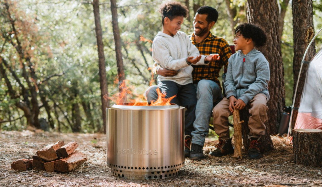 people sitting around solo stove