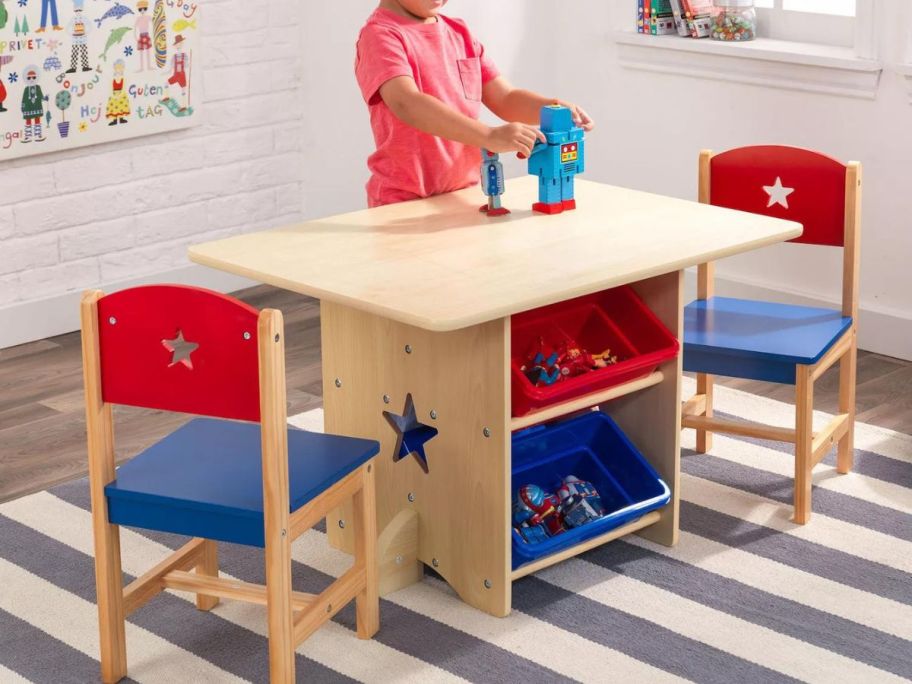 child playing on KidKraft Star Table & Chair Set