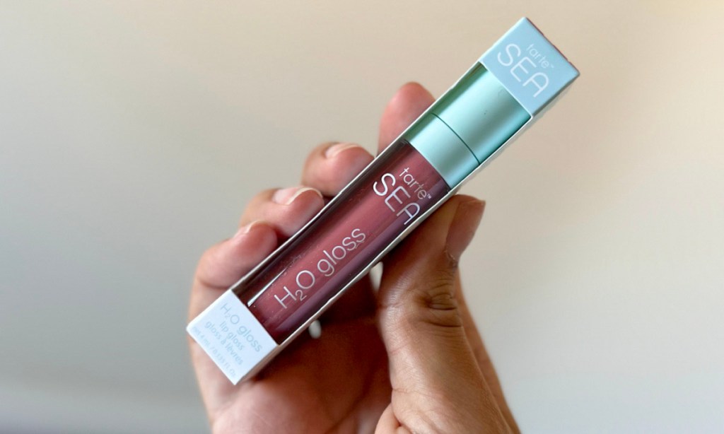 hand holding tarte sea h2o gloss