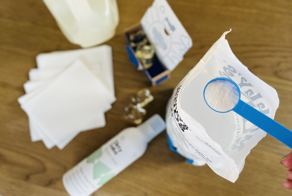 various kinds of laundry detergents on wood table