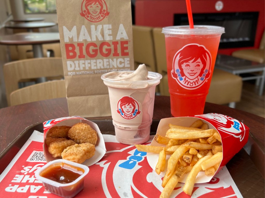 wendys chicken nuggets, fries, frosty and drink on table