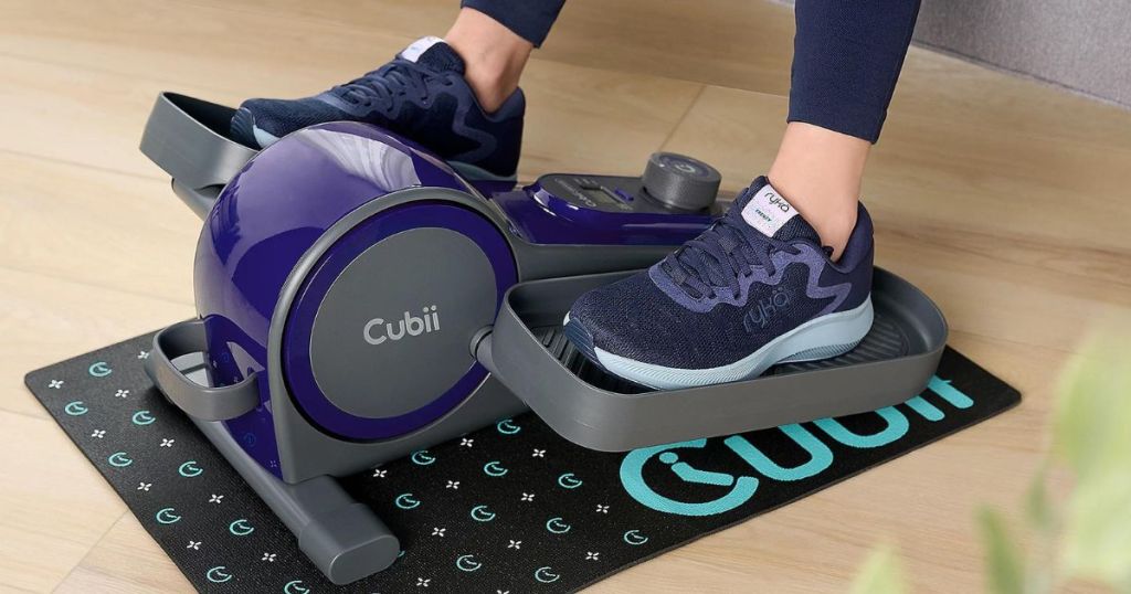 woman's feet on a Cubii Groove Seated Elliptical