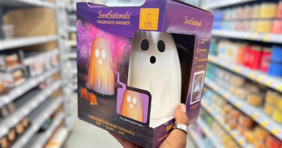 hand holding a box with a ghost shaped wax warmer in Walmart