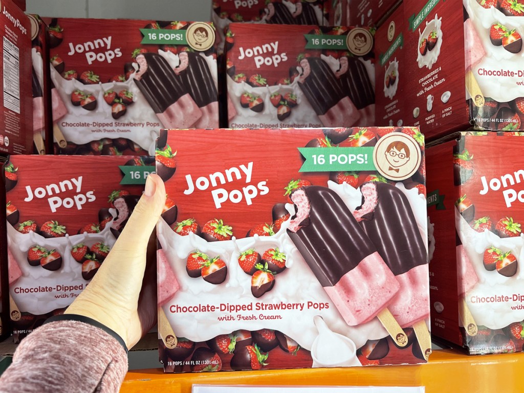 hand holding box of Jonny Pops Chocolate Dipped Strawberry Pops