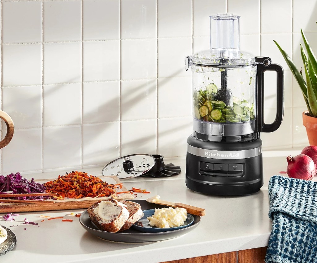 KitchenAid Food Processor on a counter with food around it
