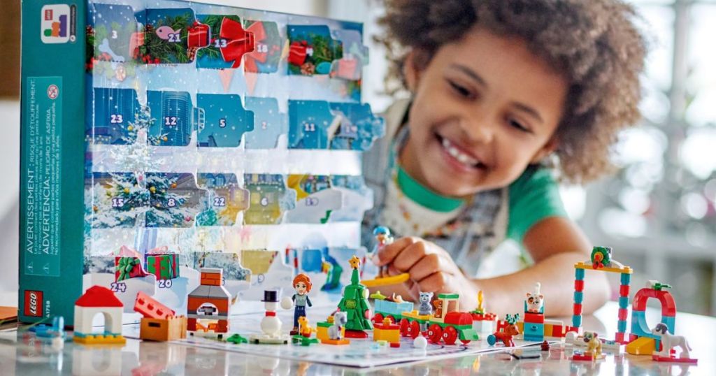 a child playing with a LEGO & Friends advent calendar 