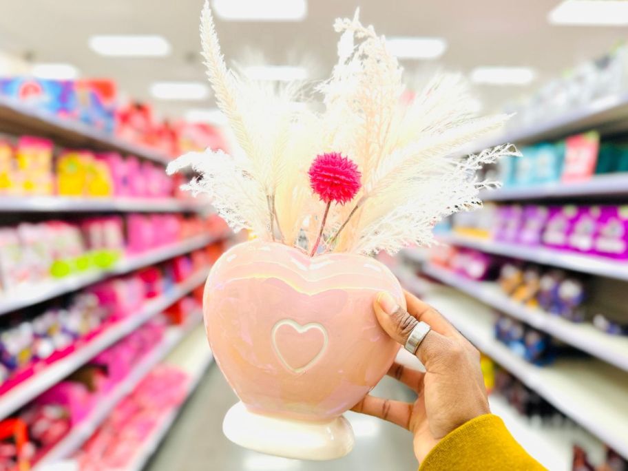 Hand holding up a Spritz Valentine's Day Vase decoration