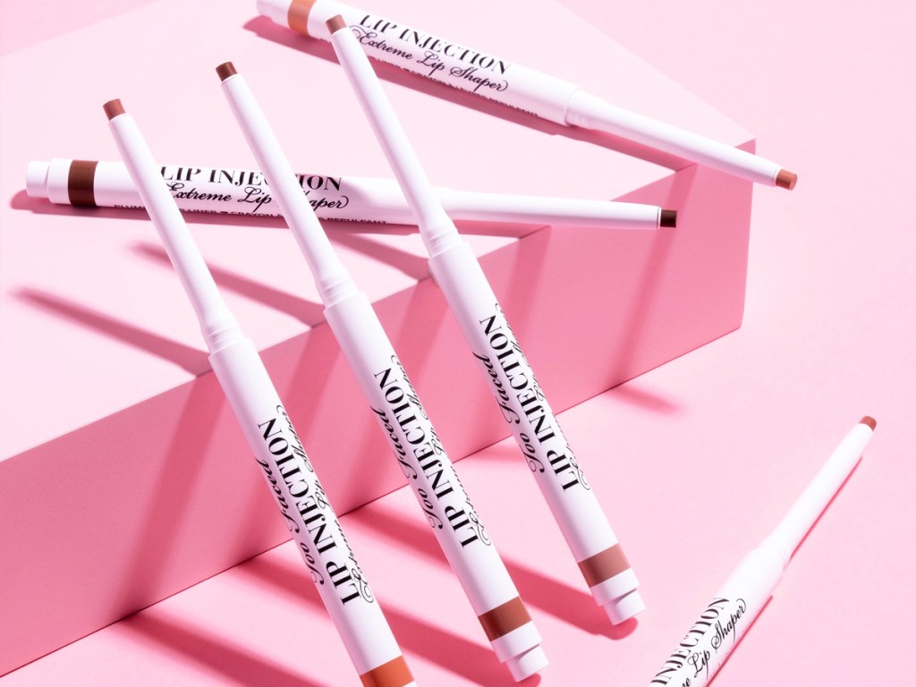 too faced lip liners on pink background