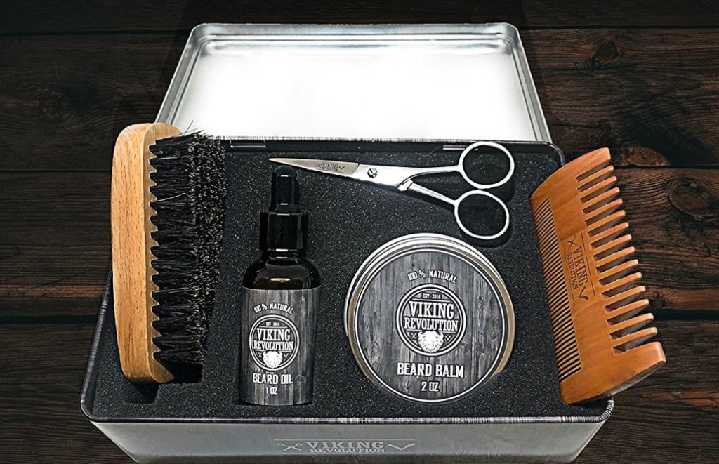 Tin box with scissors, comb, brush, and beard oil