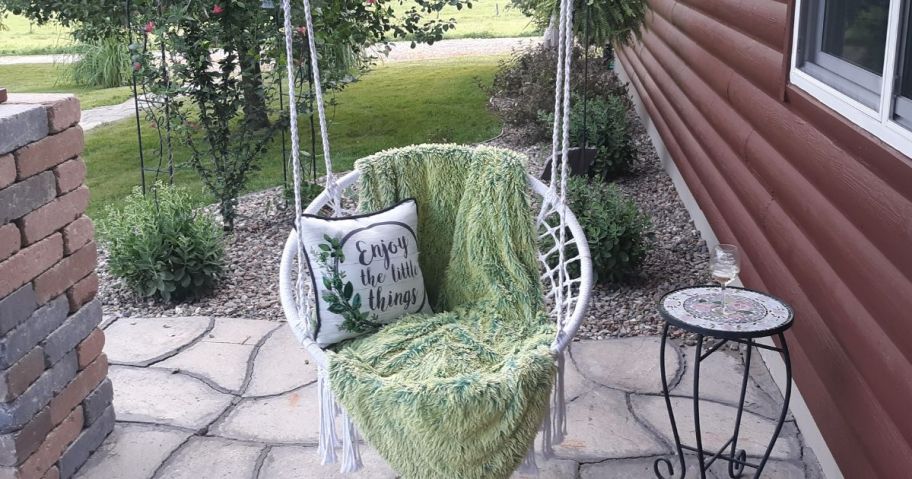 A Macrame Hanging Hammock Chair on a porch