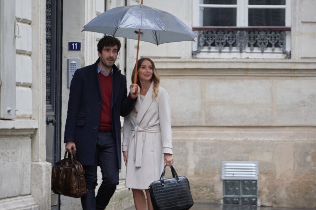 man and woman under umbrella in Paris