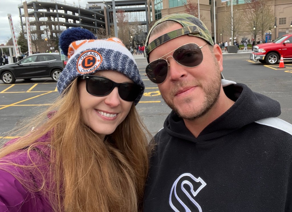 couple standing outside at sox game