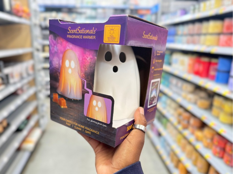 hand holding a box with a ghost shaped wax warmer in Walmart