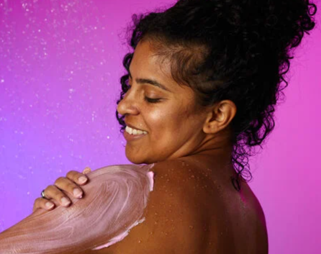 woman applying body conditioner