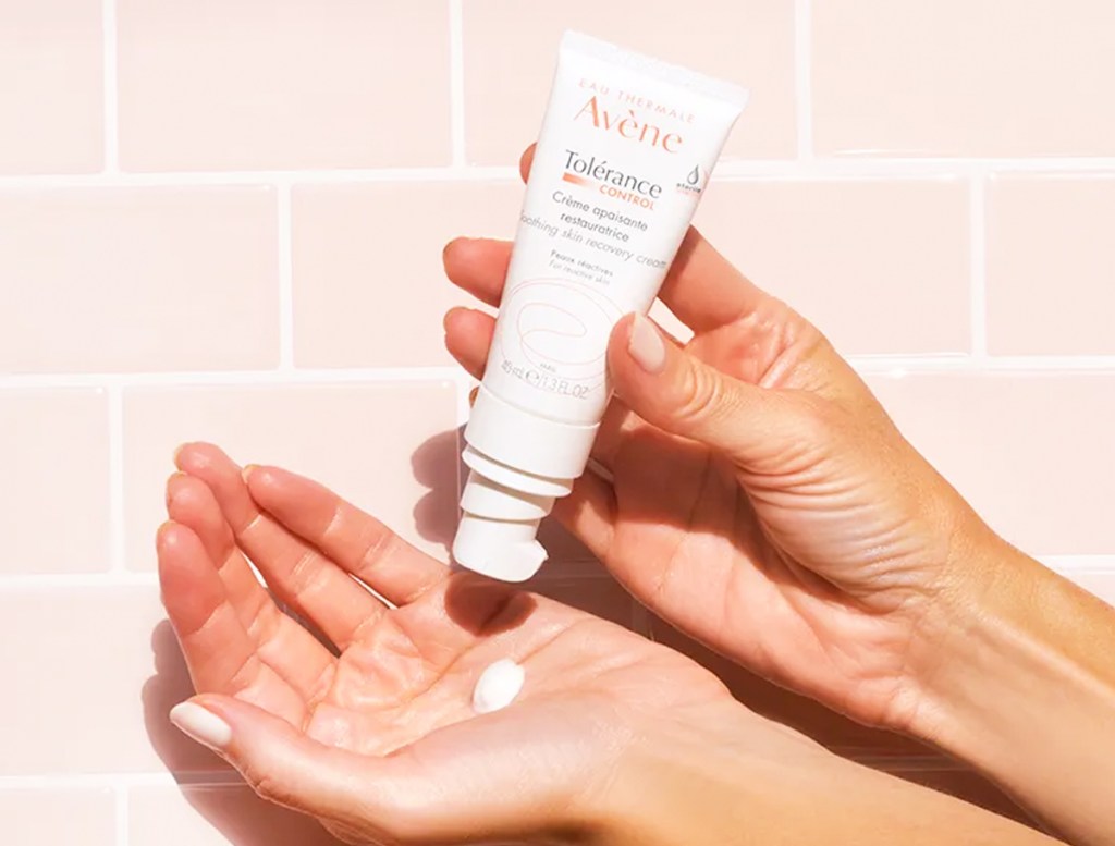 applying Avene Tolerance Control Skin Recovery Cream to hands