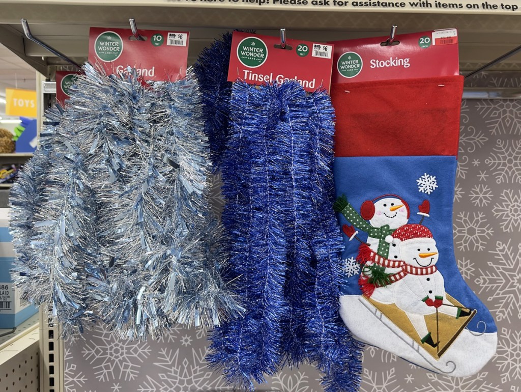 christmas tinsel and stockings on store display