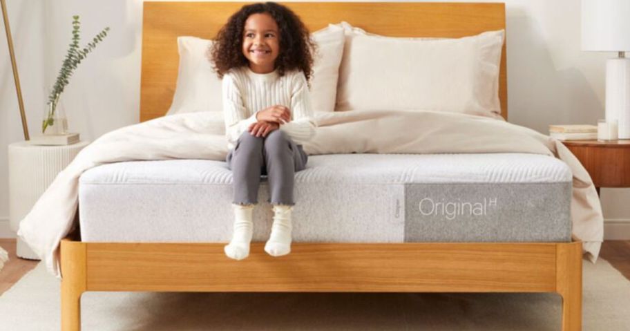 little girl sitting on Casper Original Mattress