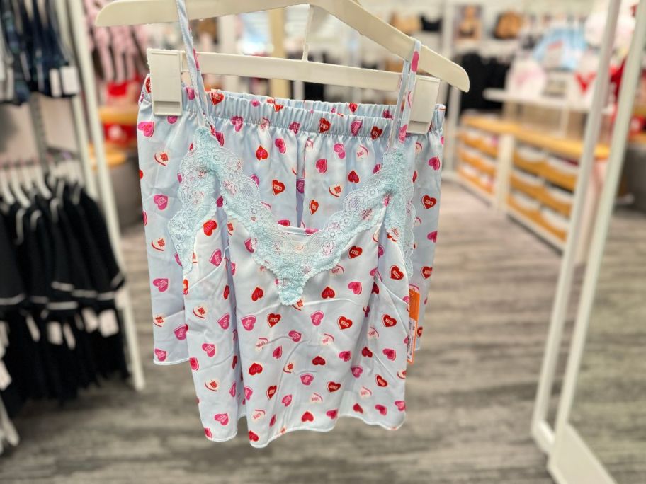 Colsie Women's Satin Tank and Shorts Pajama Set hanging in the store 