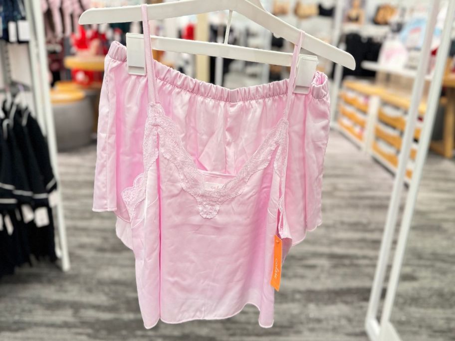 Colsie Women's Satin Tank and Shorts Pajama Set hanging in the store 