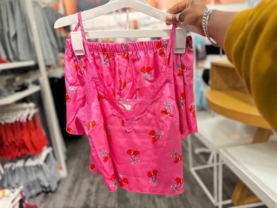 Colsie Women's Satin Tank and Shorts Pajama Set hanging in the store 