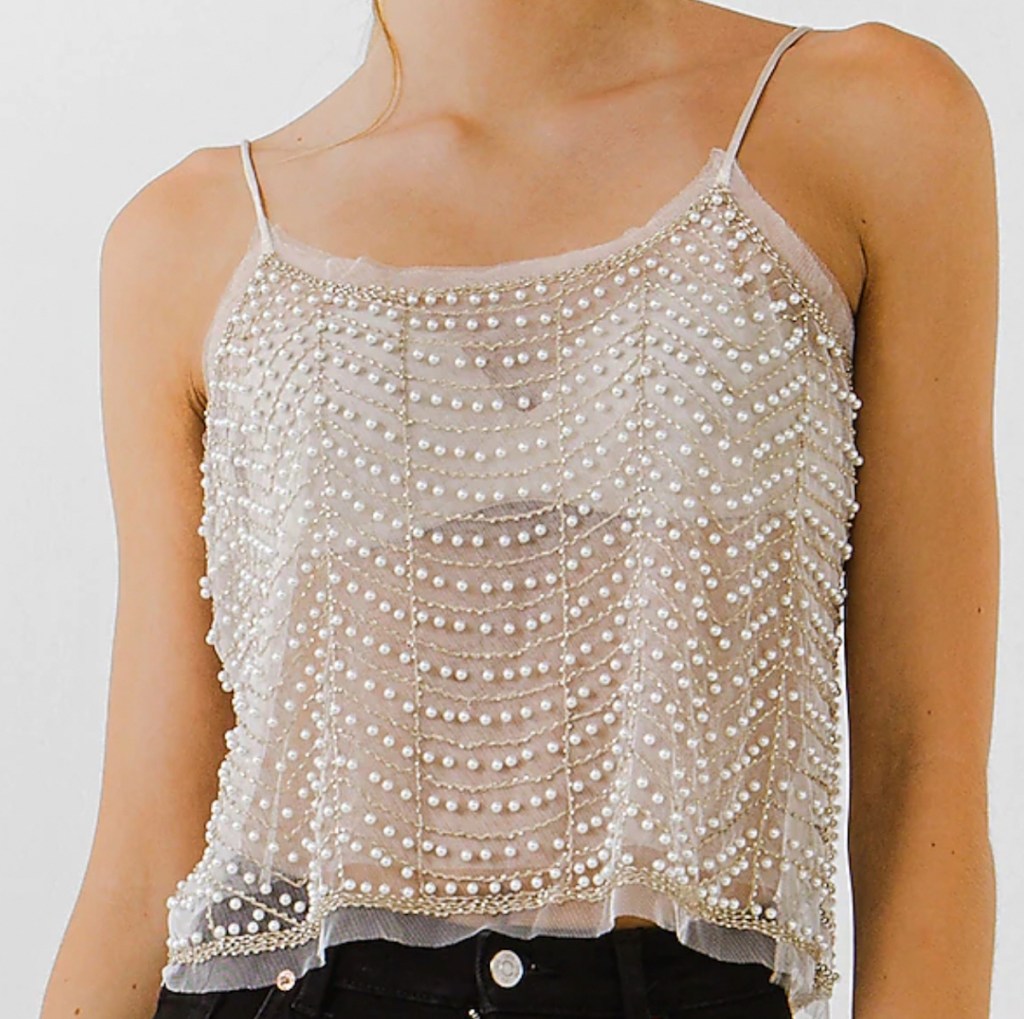 stock photo of woman wearing see through embellished cami