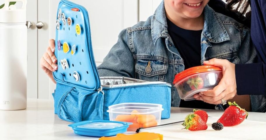 Boy packing a Fit & Fresh Lunch Bag