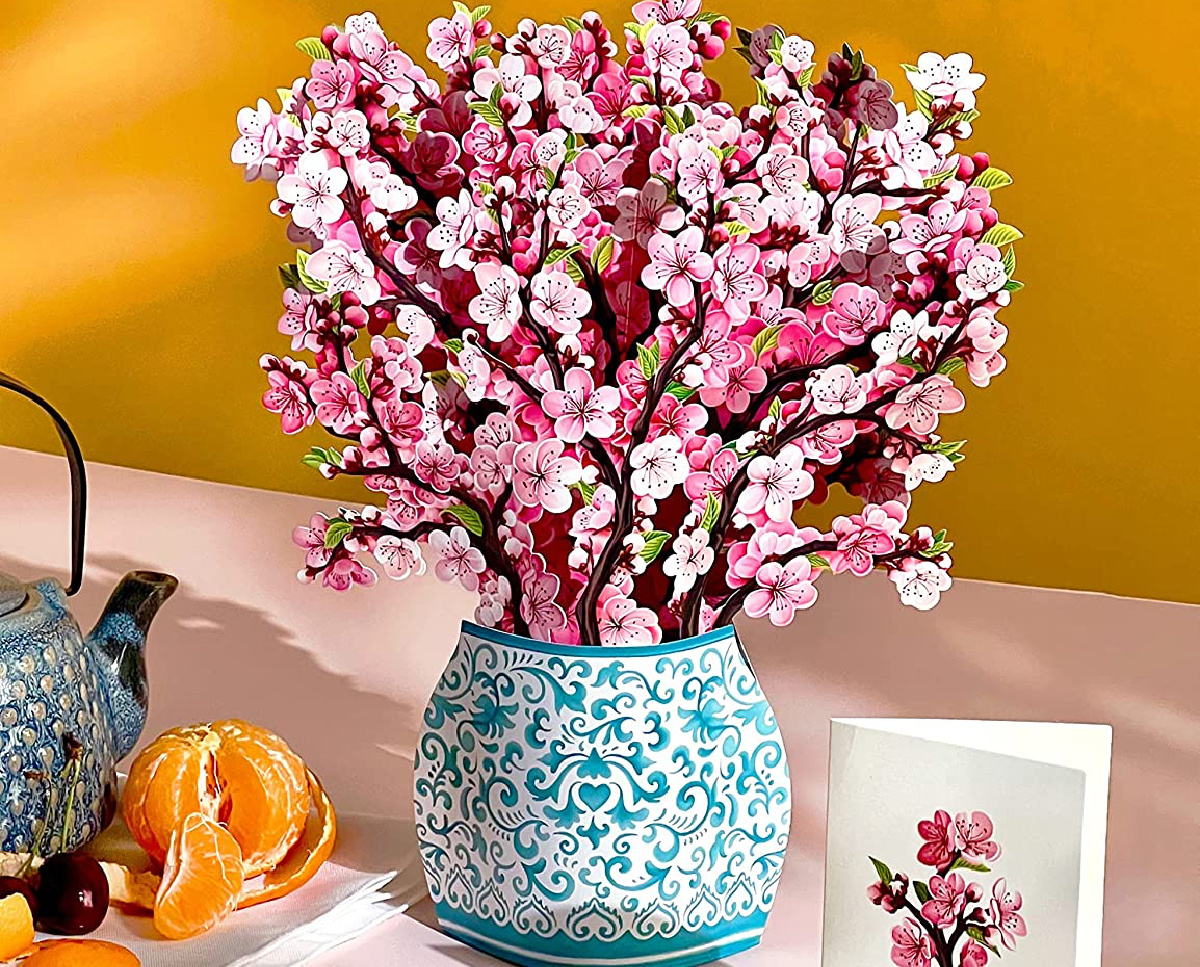 Freshcut Paper Cherry Blossoms Pop Up Cards with items around it