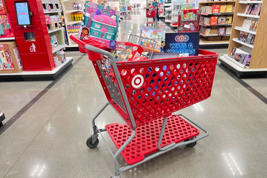 Target shopping cart full of toys in middle of store aisle
