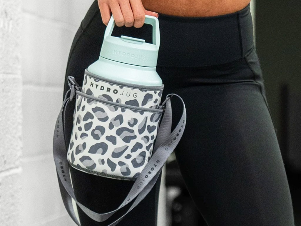 woman holding hydrojug in leopard print sleeve