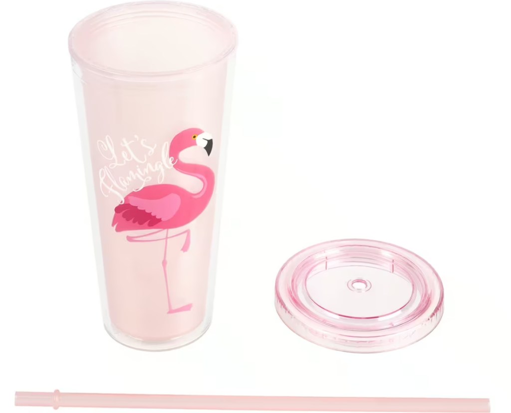 Pink tumbler with a flamingo on it and the lid next to it with the straw below both