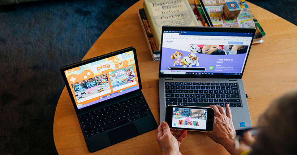 Noggin displayed on a phone and two laptops