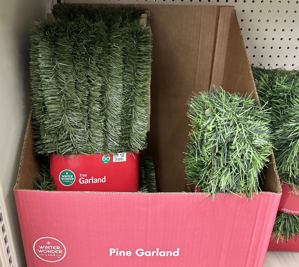 red box full of pine garland