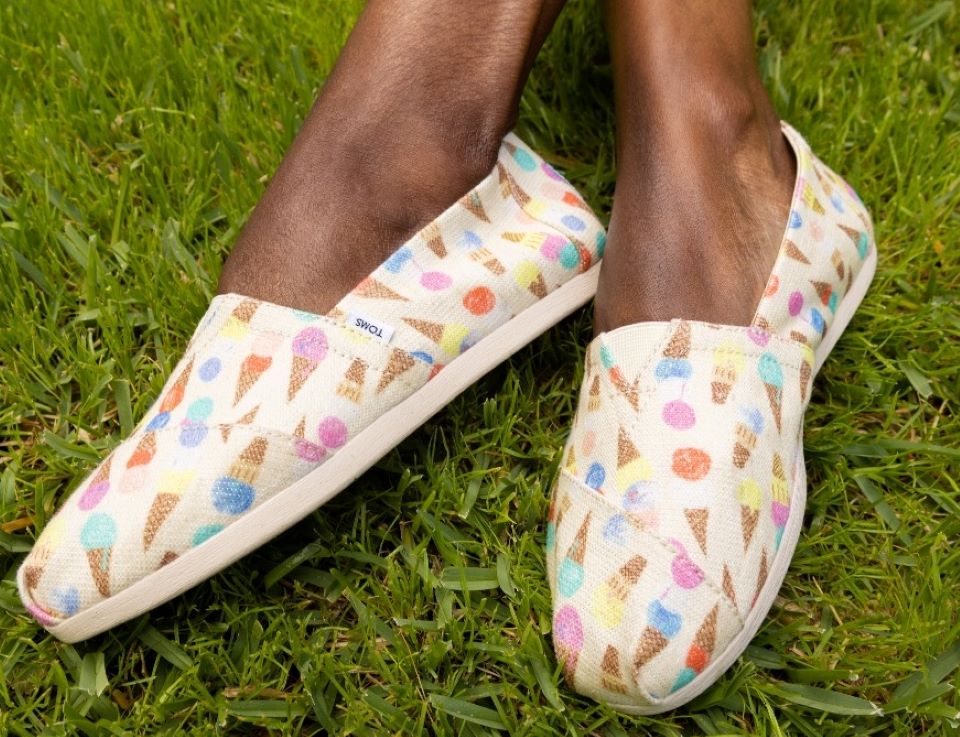 Woman wearing TOMS shoes with ice cream cones on them