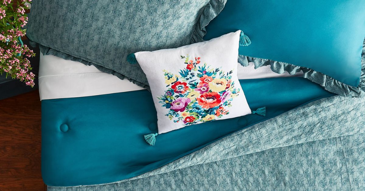 blueish green comforter set with floral accent pillow