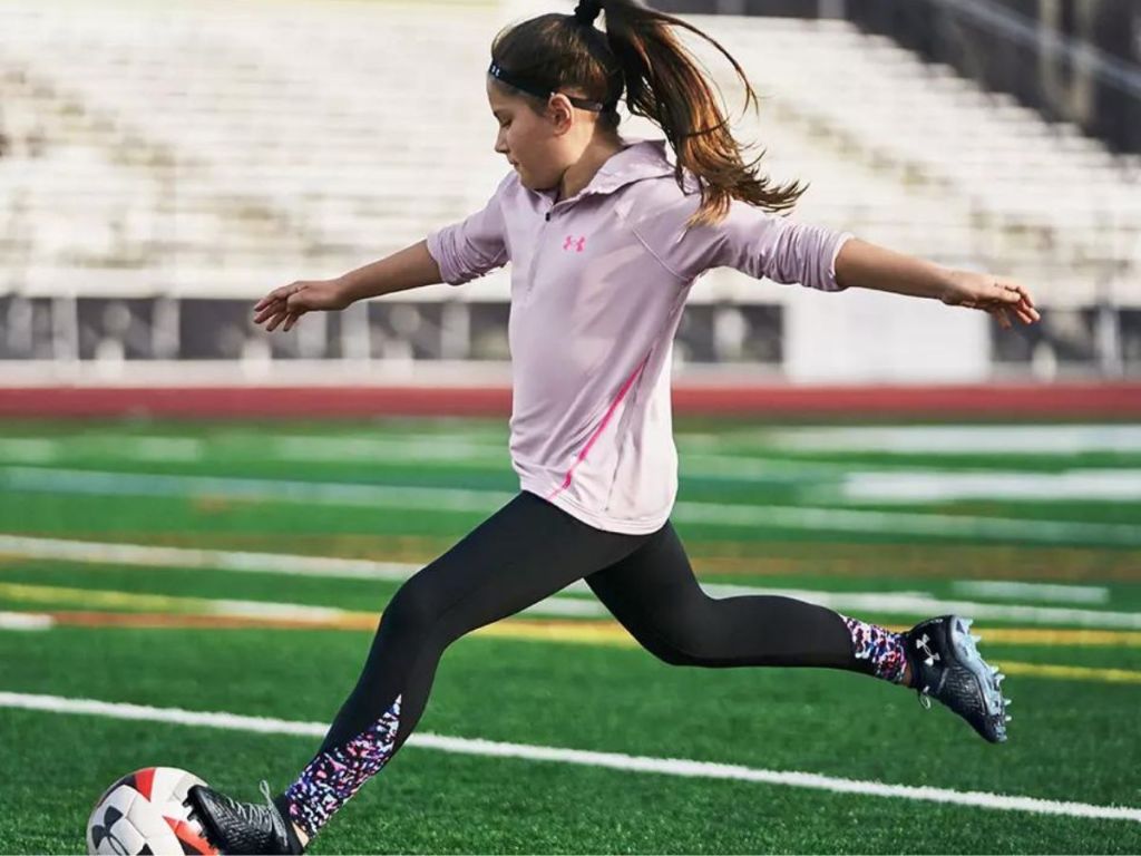 Little girl playing soccer