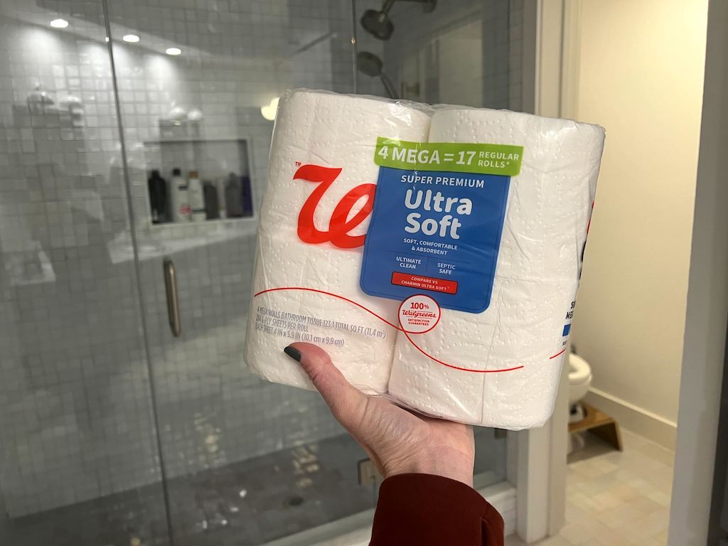 holding pack of Walgreens brand toilet paper