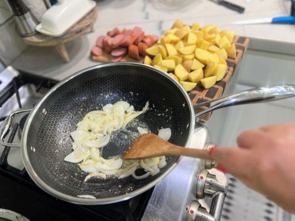 adding onions to skillet