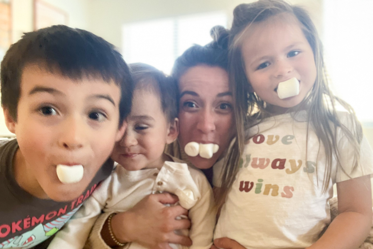family with marshmallows in their mouths