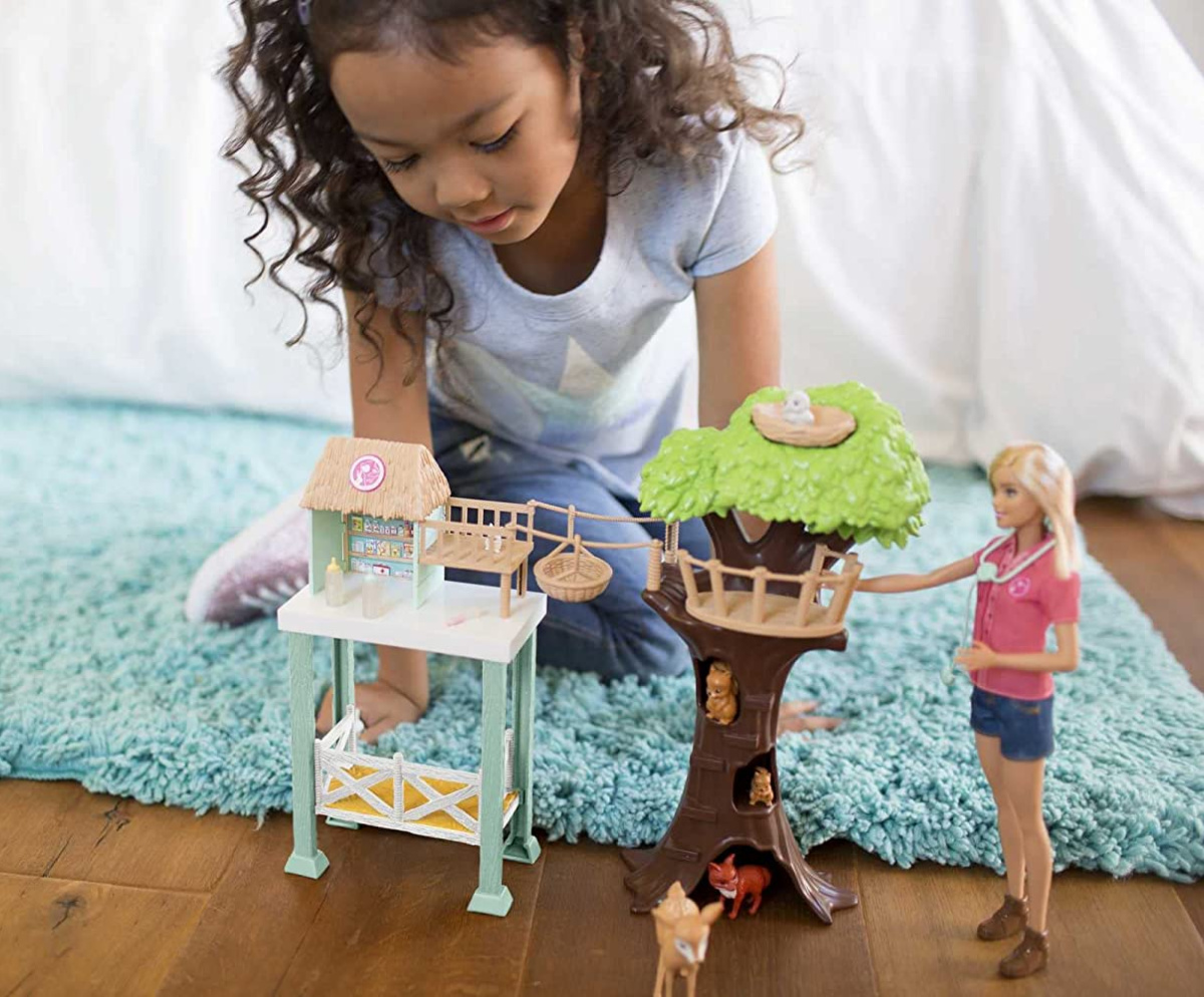 Girl playing with the Barbie Doll Animal Rescue Center