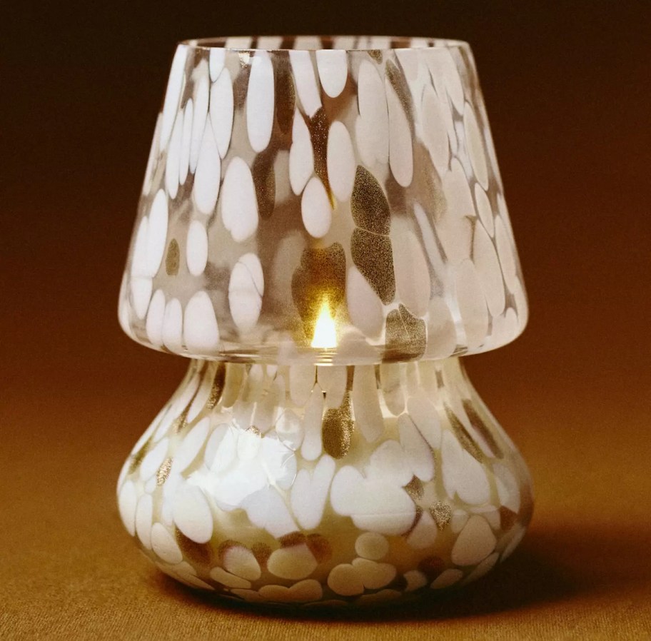 white mushroom candle on brown background