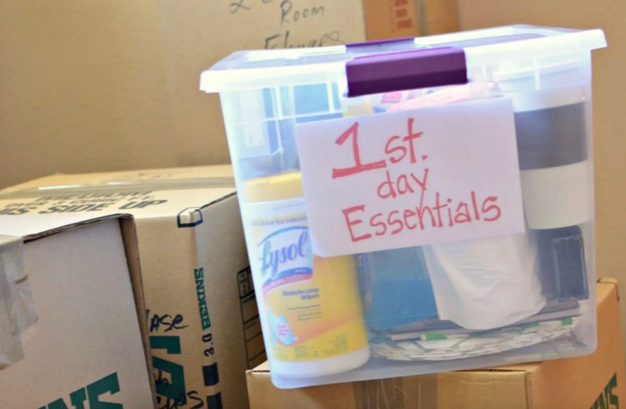 clear bin labeled with first day moving essentials