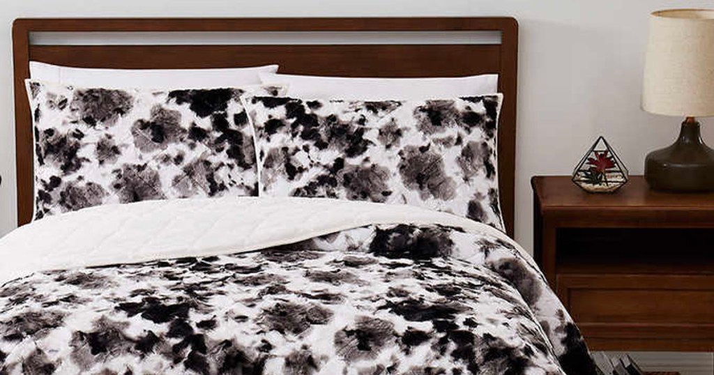 black and white comforter set on bed