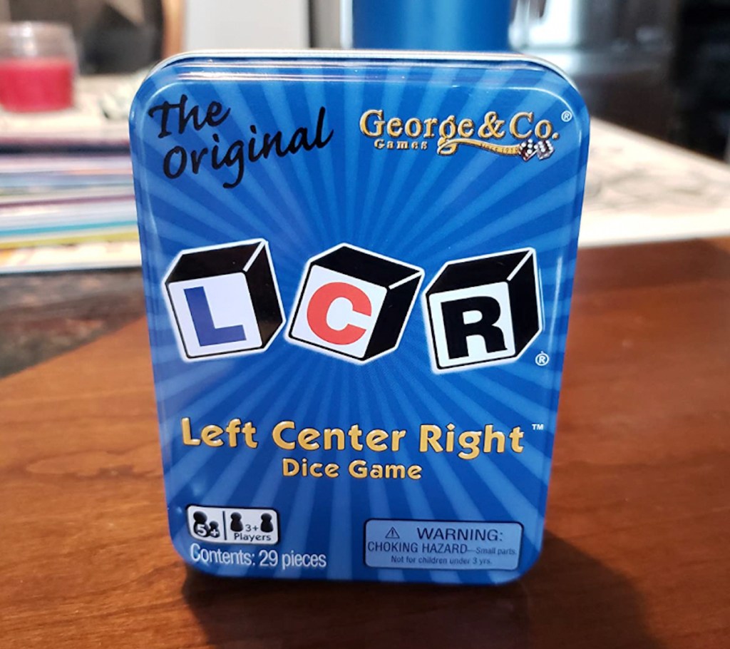 left center right dice game on wood table 