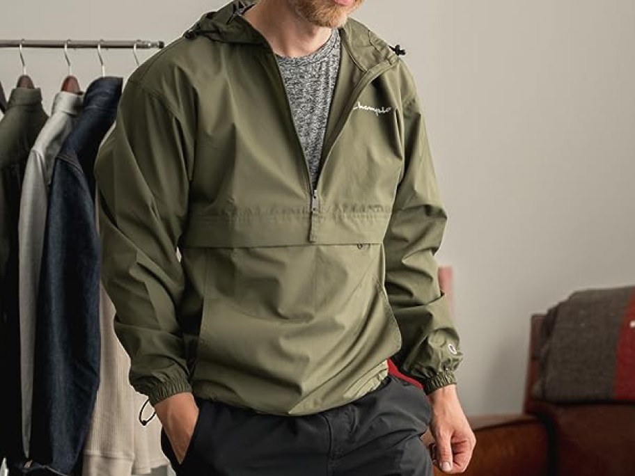 man wearing champion jacket in green