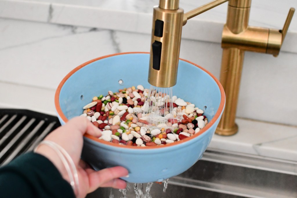 rinsing beans in a colander