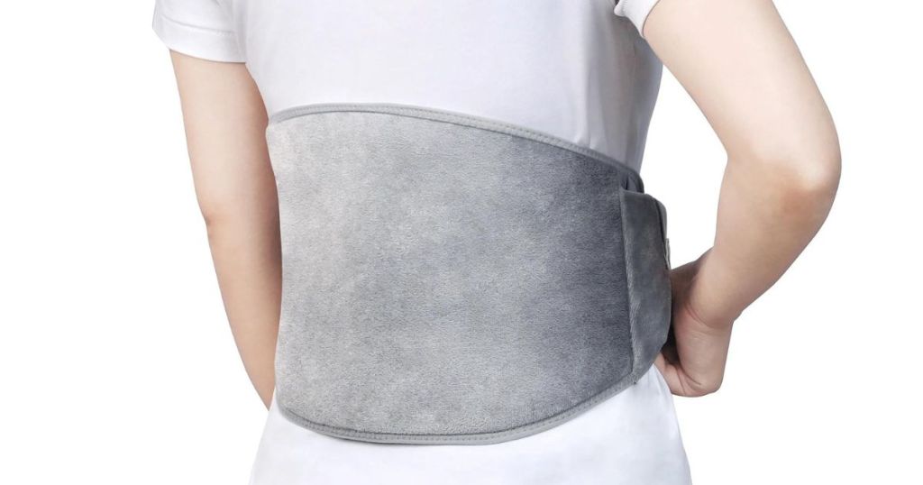 person with wearable heating pad around waist